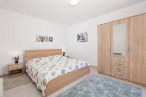 Postel nebo postele na pokoji v ubytování Apartments Vilma