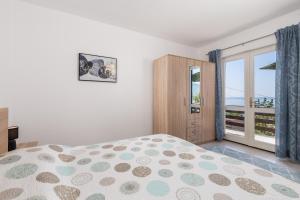 Postel nebo postele na pokoji v ubytování Apartments Vilma