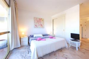 Postel nebo postele na pokoji v ubytování Romana Playa studio Elviria + 13 fotografií