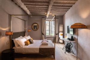 Postel nebo postele na pokoji v ubytování Drogheria e Locanda Franci