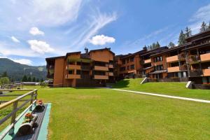 a view of an apartment complex with a green lawn at RIO FALZE' Wood in Madonna di Campiglio