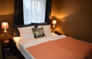 Cama ou camas em um quarto em Hotel Leifur Eiriksson
