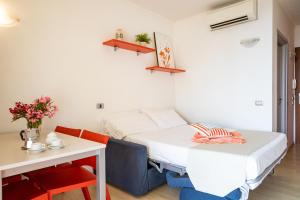 Кровать или кровати в номере Residence Mediterraneo