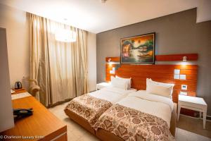 Letto o letti in una camera di Charleson Luxury Hotel
