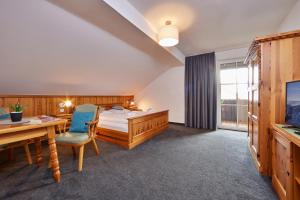 TV a/nebo společenská místnost v ubytování Hotel Alter Wirth