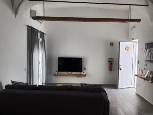 Televiisor ja/või meelelahutuskeskus majutusasutuses Casinhas da Avó Aura