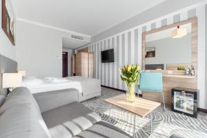 Televiisor ja/või meelelahutuskeskus majutusasutuses Hotel Leda Spa - Adults Only