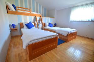 En eller flere senger på et rom på Apartment Drazovic
