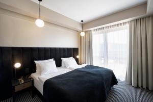 Voodi või voodid majutusasutuse Hotel Leda Spa - Adults Only toas
