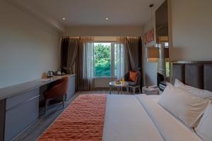 Postel nebo postele na pokoji v ubytování Hotel Saket 27
