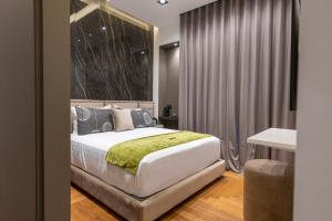 Ένα ή περισσότερα κρεβάτια σε δωμάτιο στο B&Z LUXURY