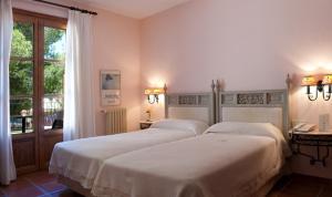 Postel nebo postele na pokoji v ubytování Hotel Bahia