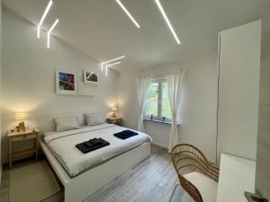 Postel nebo postele na pokoji v ubytování Lambda Holiday Apartments
