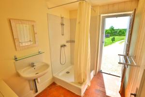 a bathroom with a sink and a shower at Domaine de Matounet in Bridoré +55 photos