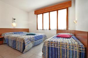
Letto o letti in una camera di Apartments Villa Elisabeth Lignano Pineta - IVN01485-DYB
