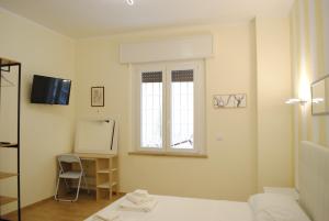 TV a/nebo společenská místnost v ubytování Dreaming Piazza Erbe Rooms