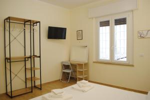 Postel nebo postele na pokoji v ubytování Dreaming Piazza Erbe Rooms