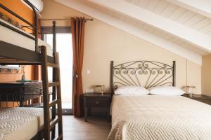 A bed or beds in a room at Gold Olive Suites by "elite"