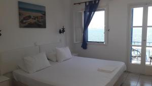 Posteľ alebo postele v izbe v ubytovaní Pavlos Rooms