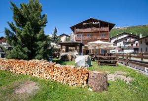 a building with a pile of firebreaks in front of it at Hotel Galli in Livigno