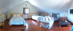 A bed or beds in a room at O Rincón de David