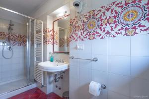 a bathroom with a sink and a shower at Villa Ape Rosa Relais in Florence +49 photos