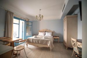 Ένα ή περισσότερα κρεβάτια σε δωμάτιο στο Elysium Living Parga