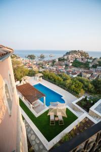 an aerial view of a house with a swimming pool at Elysium Living Parga in Parga