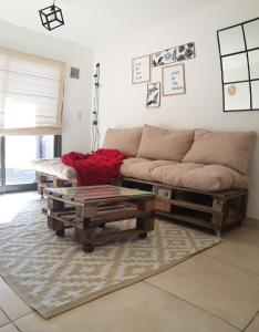 a living room with a couch and a coffee table at Alto Tucumán in Córdoba