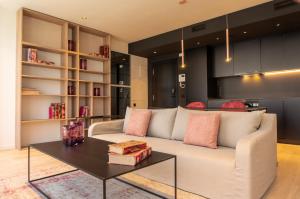 a living room with a couch and a table at Valencia Luxury - Sea Port II in Valencia