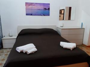 Postelja oz. postelje v sobi nastanitve Casetta Relax da Antonio