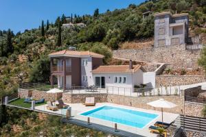 an image of a villa with a swimming pool at Koumaries Villas in Lygia
