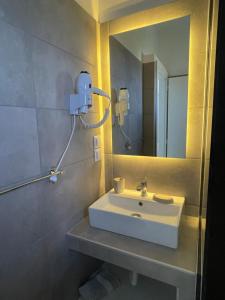 a bathroom with a sink and a mirror at Pargas paradise in Parga +22 photos