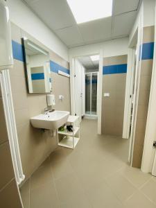 a bathroom with a sink and a mirror at Casa delle Giuggiole in Dogna