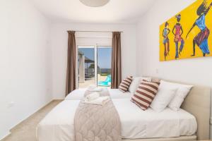 Ένα ή περισσότερα κρεβάτια σε δωμάτιο στο South Beach Villas +63 φωτογραφίες