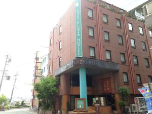 a building with a sign on the side of it at Nagano Plaza Hotel in Nagano