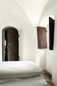 Uma cama ou camas num quarto em Hotel Weiss Kreuz