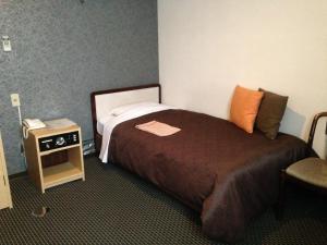 Postel nebo postele na pokoji v ubytování Nagano Plaza Hotel