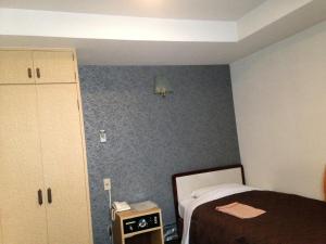 Postel nebo postele na pokoji v ubytování Nagano Plaza Hotel