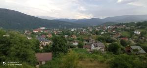 a town in a valley with mountains in the background at Садиба Лісовичок in Yaremche