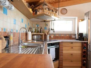 a kitchen with a sink and a stove at Ferienhaus Baraka - Medveja in Lovran