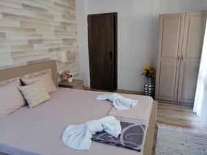 Postel nebo postele na pokoji v ubytování Guest House Juja