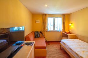 Postel nebo postele na pokoji v ubytování Sonne Bezau - Familotel Bregenzerwald + 37 fotografií