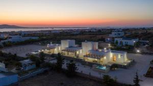 an aerial view of a large building at sunset at Bluebell Resort Villa SUNRISE in Kampos Paros