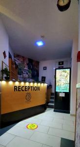 a reception desk in a building with a sign on it at Hotel Blagaj Mostar in Blagaj