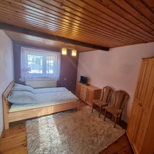 Postel nebo postele na pokoji v ubytování Kryniczanka