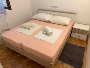 Postel nebo postele na pokoji v ubytování Apartments Vasilić