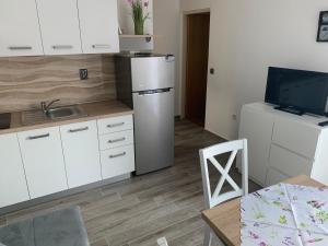 Kuchyň nebo kuchyňský kout v ubytování Apartments Vasilić