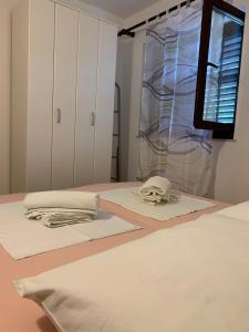Postel nebo postele na pokoji v ubytování Apartments Vasilić