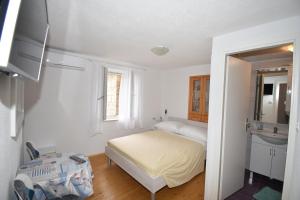 Posteľ alebo postele v izbe v ubytovaní Apartmani Mihaela